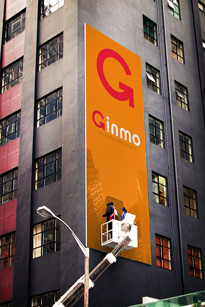 Aplicación de diseño de identidad corporativa Ginmo Gestoría Inmobiliaria.